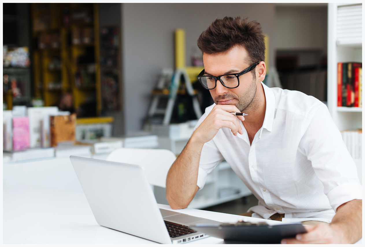 Student working on laptop in library